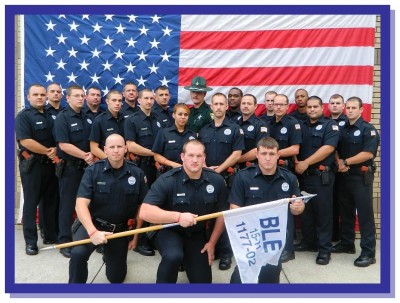 law classdec11 400x303 IPS Honors 21 Law Enforcement Grads
